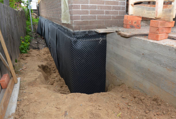 Happy homeowners after waterproofing job in Stevensville